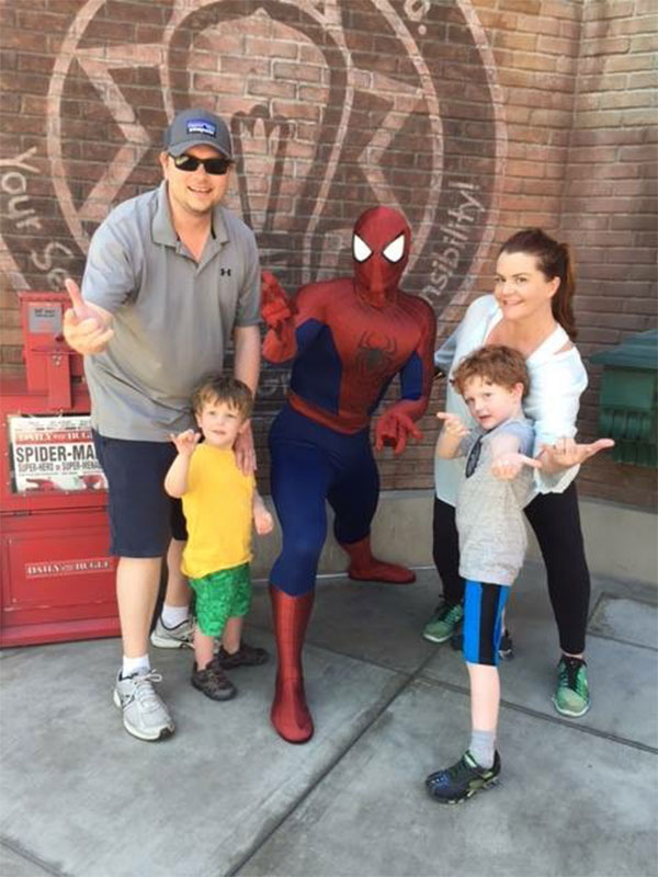 Danaria McCopy with husband, two sons, and Spideman